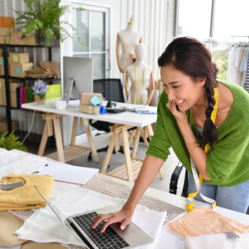 Woman running a business and using a laptop computer