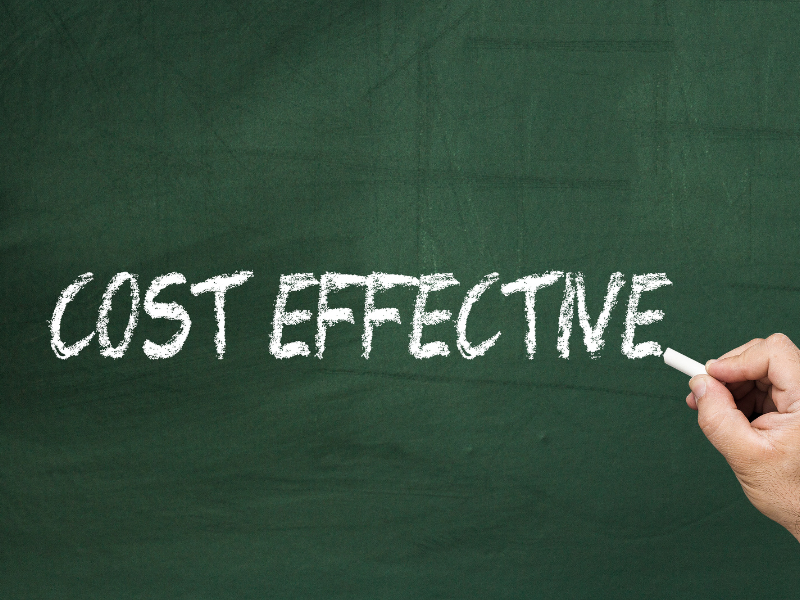 The word "cost effective" on a chalkboard.