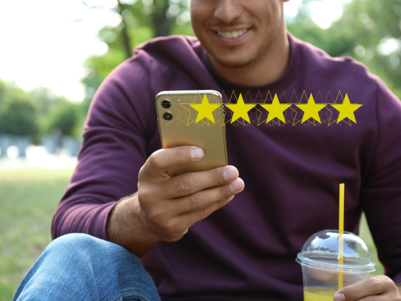 Man looking at reviews on a smartphone