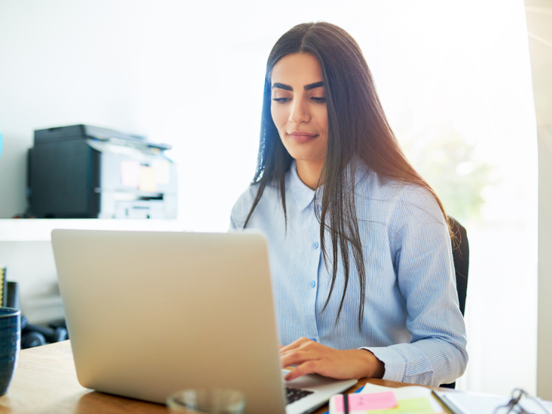 Woman working at a laptop computer