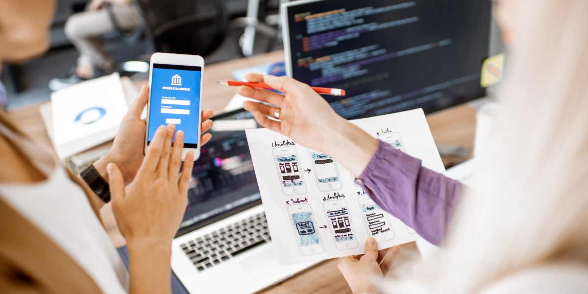 Two people looking at a mobile website on a smartphone